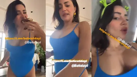 Serpil Cansız mavi bodysuitte kek yiyip içki içerek şov yapıyor